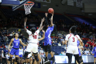 Rutgers' Victoria Harris attempts to defend a shot by UB's Theresa Onwuku.