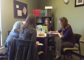 Library and Information Studies students studying together in the LIS student lounge. 