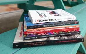 Stack of books published by GSE faculty. 
