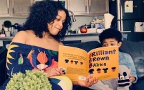 GSE alumna Desiree Williams reading book with son. 