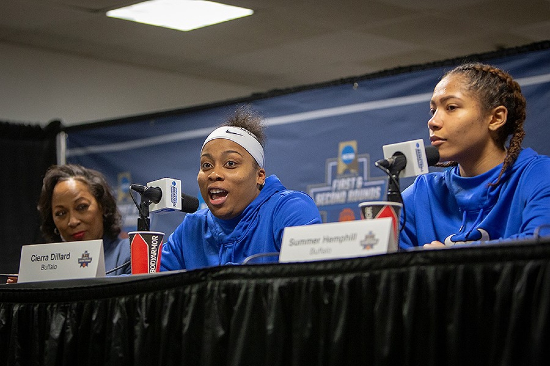 Coach Jack (left), Cierra Dillard (center) and Summer Hemphill discuss the details at a post-game press conference.
