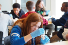 Madison Kuss, a student at Hillery Park School 27, focuses on her experiment.