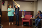 The winner: Wendy Quinton holds the first-place oar. At left is Allison Suflita, academic adviser in the Honors College. Photo: Douglas Levere 