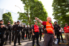 Joshua B. Sticht, deputy chief, University Police, gives direction to a group of emergency responders gathered at Washington and High streets.