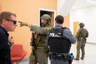 A member of Erie County Emergency Services (second from left) talks with a UBPD officer (second from right) in the Jacobs School.