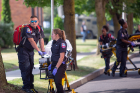 EMT responders remove the "injured" along Washington Street. 