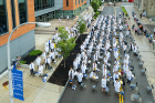 Residents stand during the Long White Coat Ceremony. Photo: Douglas Levere