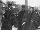 University of Buffalo Council Chair Walter P. Cooke (center) presents the keys to Foster Hall to Samuel P. Capen (left). Oren Foster is pictured at right.