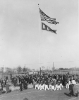 A marching band plays as the flags are raised at the dedication of Rotary Field.