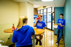 A student drinks a hot sauce-laced beverage as part of the experiment.