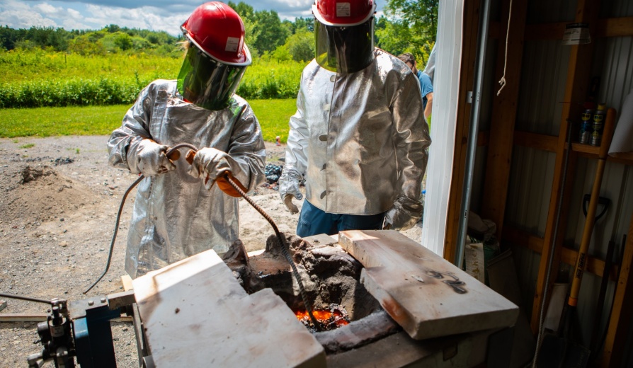 A team working with Stephan Kolzenburg, assistant professor of geology, conducted some experiments at UB’s Geohazards Field Station in the Town of Ashford, south of Buffalo, in July 2022. Kolzenburg’s research focuses on understanding the physical processes in the fields of volcanology, igneous petrology and geo-materials science. Photographer: Douglas Levere. 