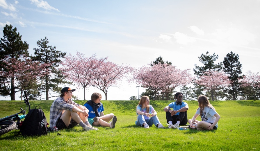 Students outside on North Campus on a sunny spring day in April 2024. Photographer: Meredith Forrest Kulwicki. 