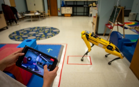 Children enrolled in the Early Childhood Research Center (ECRC) have been learning about robots this fall. In November, the School of Engineering and Applied Sciences’ robot dog, Yubie, visited the classroom in Baldy Hall. Photographer: Meredith Forrest Kulwicki. 