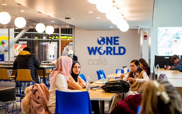 Students and others meet, study, and socialize in the spaces of One World Café in March 2022. Photographer: Douglas Levere. 