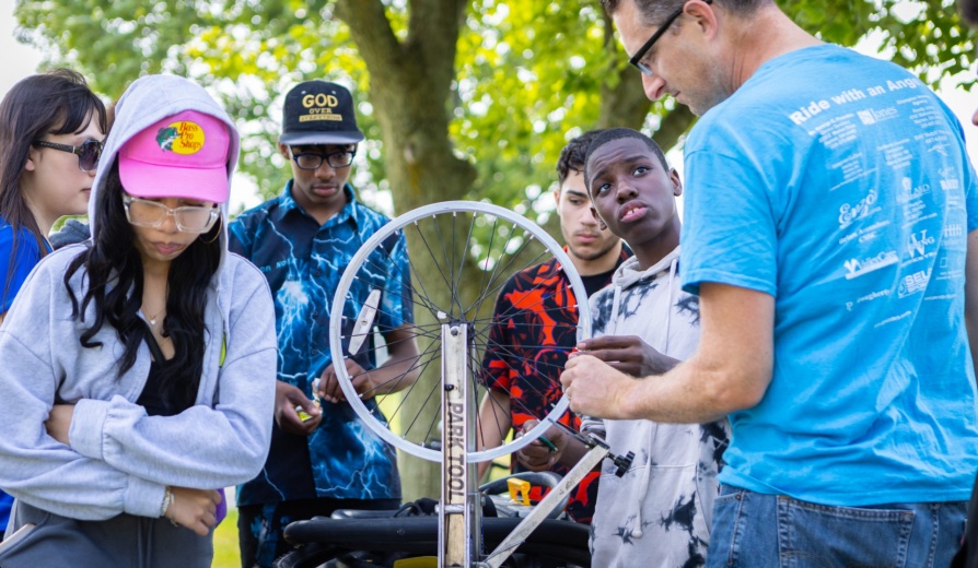 Ninth and tenth graders from Buffalo participate in the STEMcyclists Summer Camp organized by Noemi Waight, with the Graduate School of Education. Students in the program participated in cycling-related activities intended to facilitate a better understanding of how bikes work and what happens in our bodies while riding a bike. The group was photographed in the Hayes Hall Annex and in the space outside in July 2023. Photographer: Douglas Levere. 