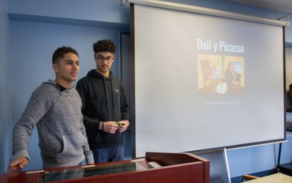 Students giving a spanish presentation. 