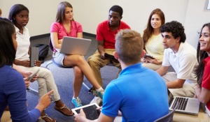 Students together in a meeting. 
