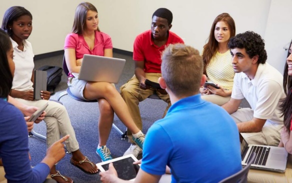 Students together in a meeting. 