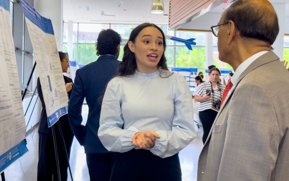 Student presenting her research poster. 