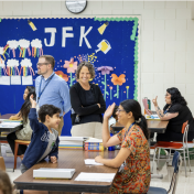 Student and his tutor high fiving. 