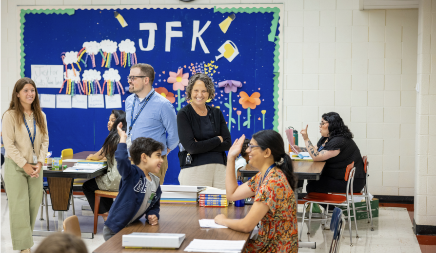 Student and his tutor high fiving. 