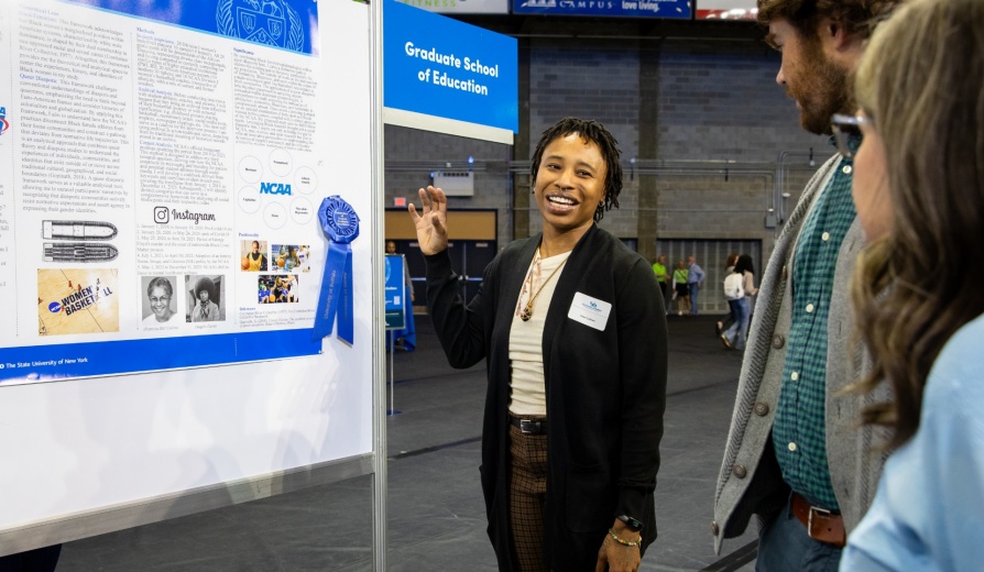 College student presents her research poster. 