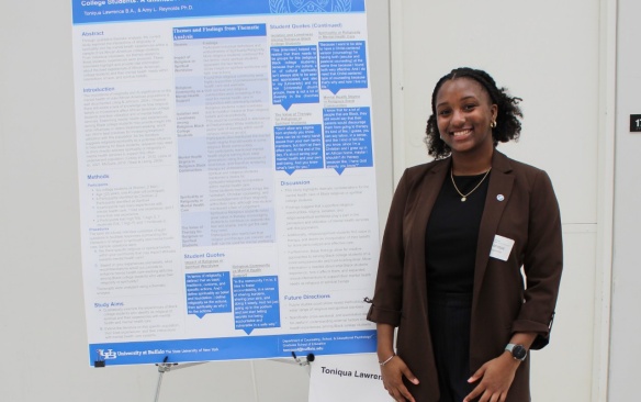 Student presents her research poster. 