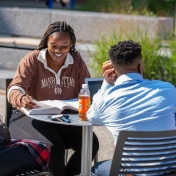 Students study at Paula’s Plaza outside the Jacobs Management Center, Alfiero Center and Park Hall in September 2022. Photographer: Douglas Levere. 