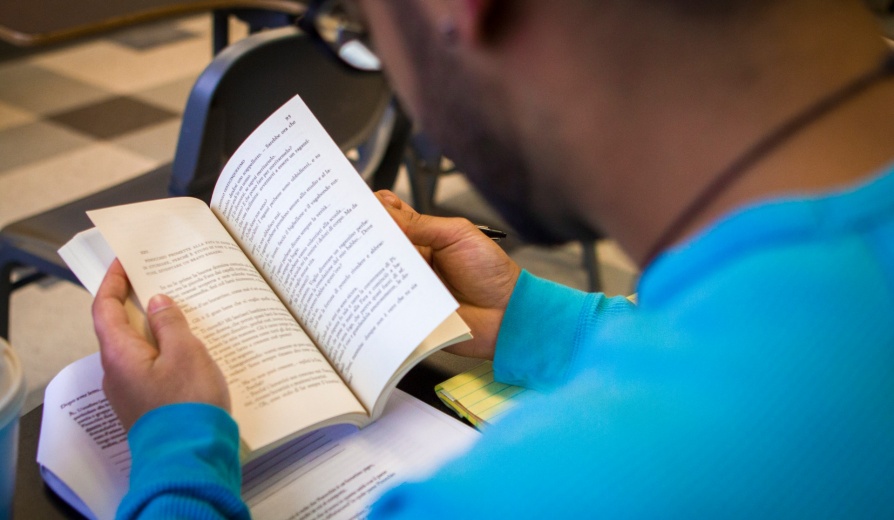 Student reading a close up book. 