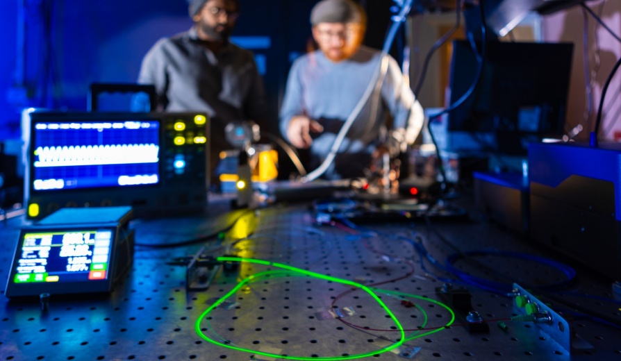 Tim Thomay, with physics, works with a student in his lab in Fronczak Hall in November 2023. Photographer: Douglas Levere. 