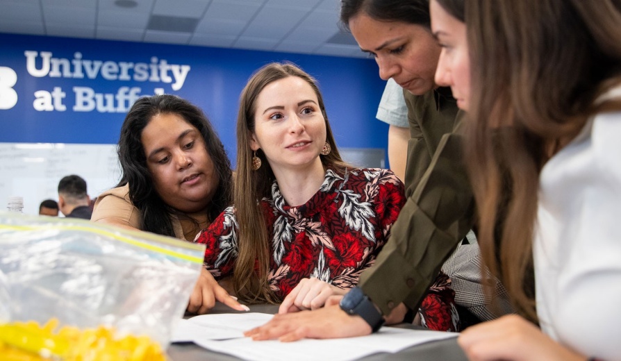 A group of sociology students meeting in Clemens Hall on UB's North Campus. 