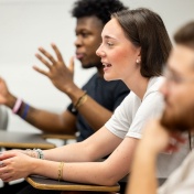 Students in class engaged in discussion. 