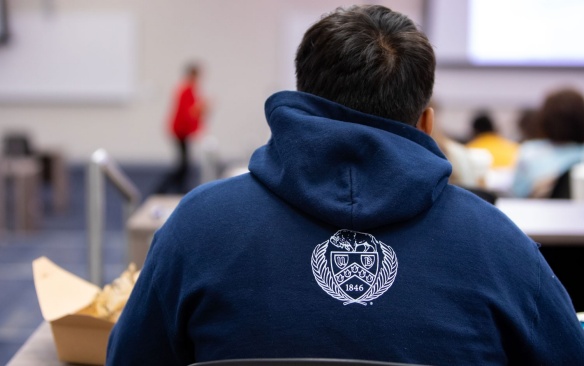 Back of a student sitting in a classroom. 