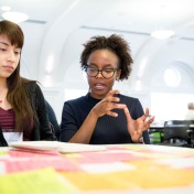 Three diverse female students meeting together. 