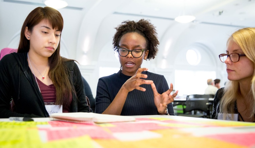 Three diverse female students meeting together. 