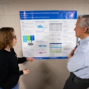 A professor analyzing a student's research poster. 