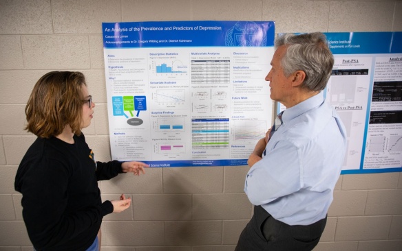 A professor analyzing a student's research poster. 