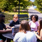 Students meting outside of Foster Hall on UB's South Campus. 