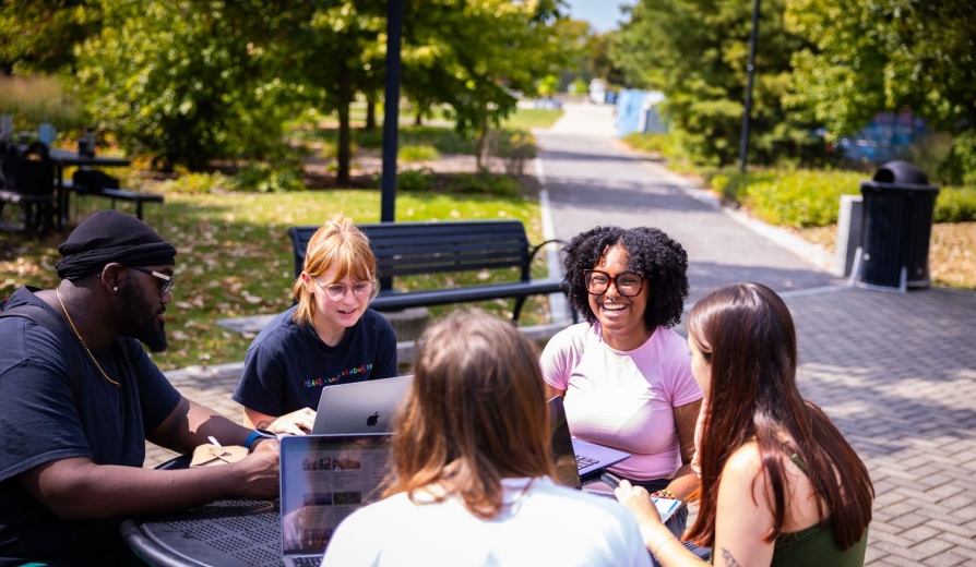 Students meting outside of Foster Hall on UB's South Campus. 