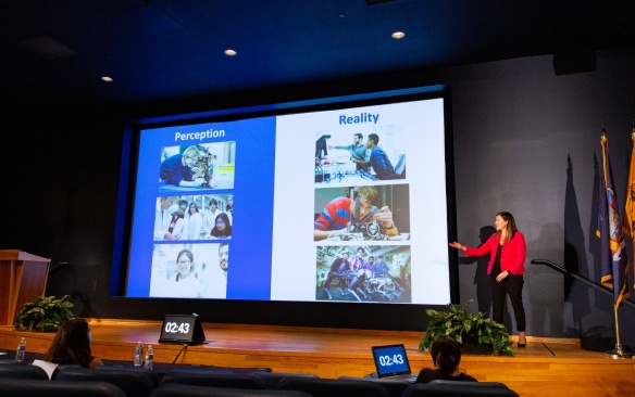 Higher Ed student presenting their thesis. 