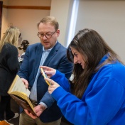 Librarian working with student. 