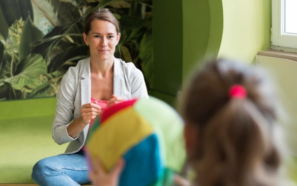 A female school counselor working with a student. 