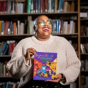 PhD student Dawnavyn James is photographed in December 2023 in the Lockwood Memorial Library. She is the author of "Beyond February: Teaching Black History Any Day, Every Day, and All Year Long," a guide for elementary school teachers — and those studying to be teachers. Photographer: Meredith Forrest Kulwicki. 