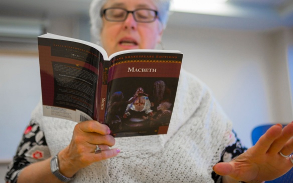 Teacher readin Macbeth to a class or students. 