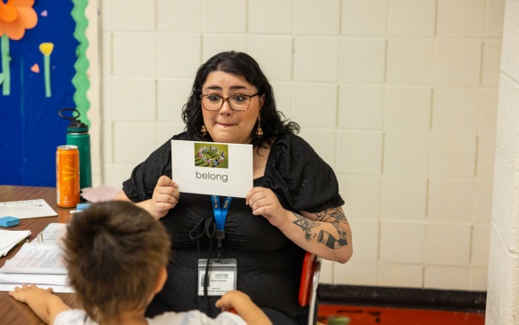 Teacher in an early childhood classroom with student. 