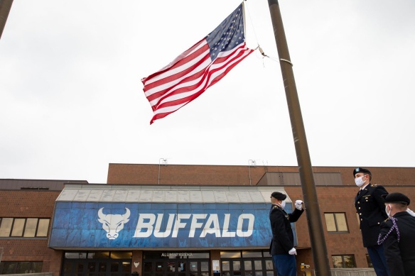 ROTC members at the University at Buffalo raising the American flag. 