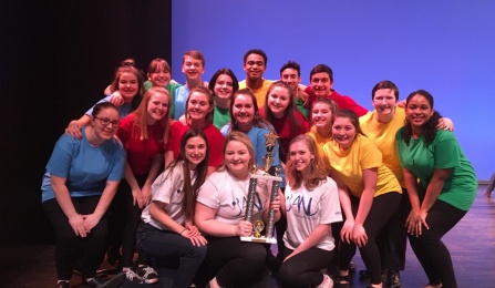 Kenmore West students holding BAND trophy. 