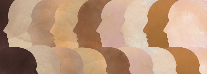 A group of diverse people with different skin tones making up a multicultural head. 