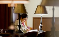 Student studying in library. 