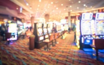 Abstract image of casino floor with slot machines. 